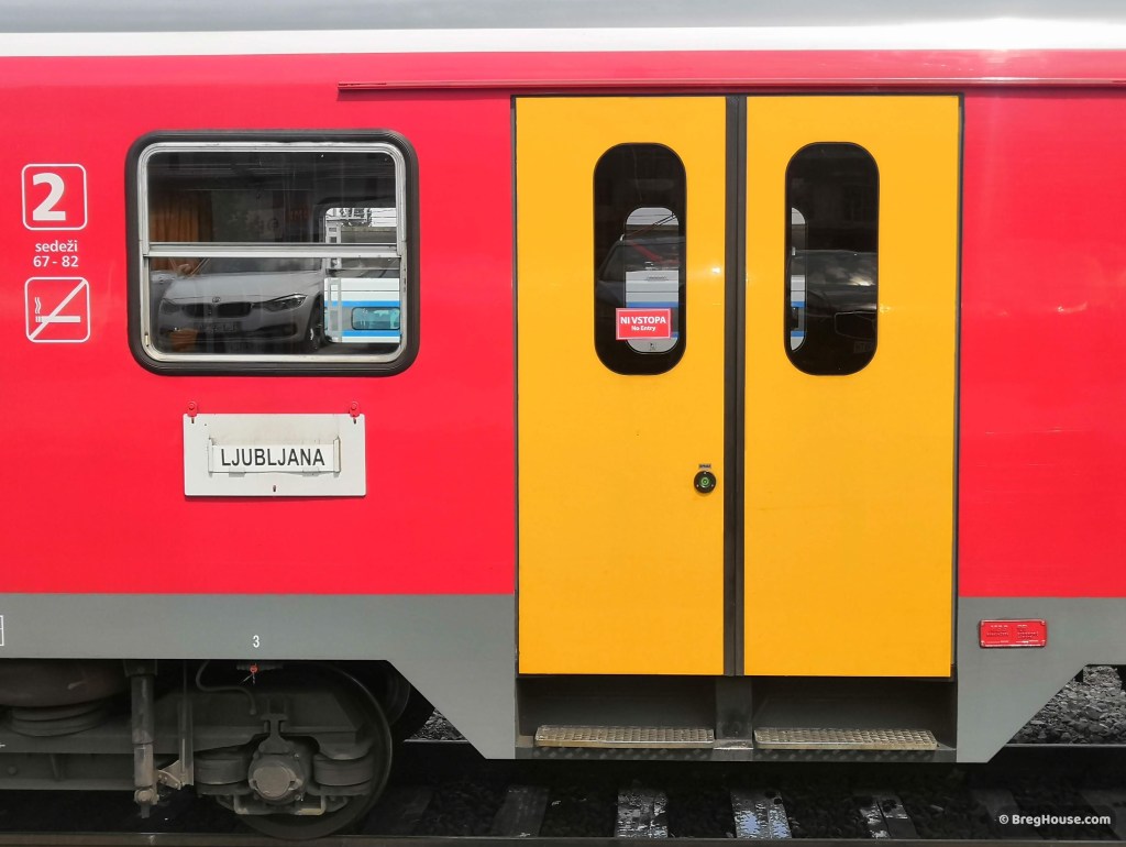 Bright red and yellow train door in Ljubljana, Slovenia