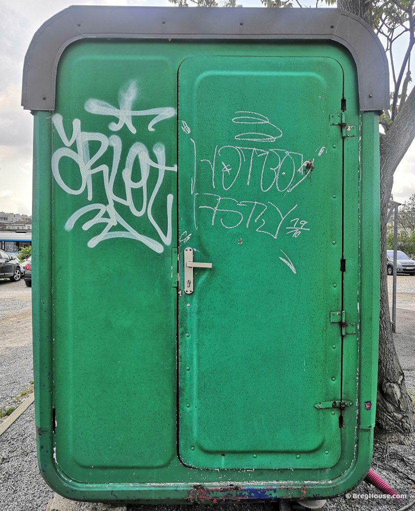 A green door on a K67 Kiosk door in Ljubljana, Slovenia