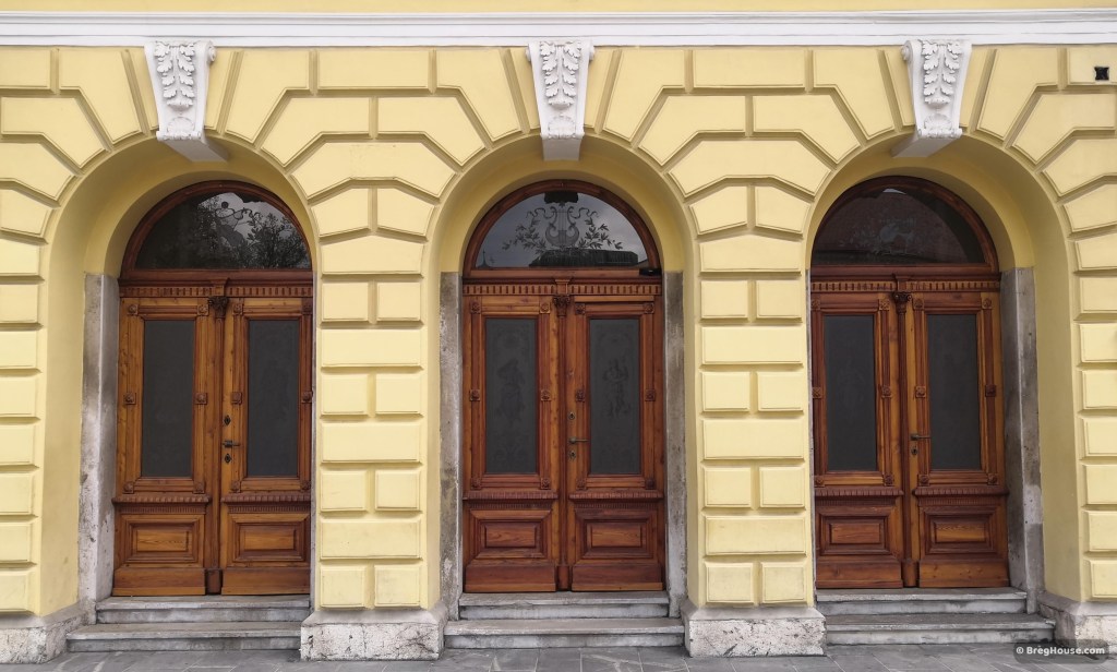 Three wooden and glass doors on the Philharmonic hall, Ljubljana, Slovenia