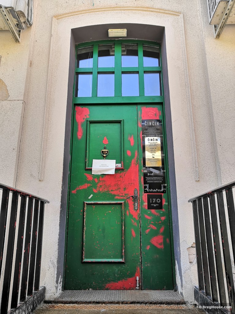 Worn green door in Ljubljana, Slovenia